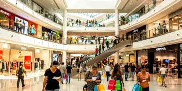 Shoppers in a bustling mall, showcasing active US consumer spending and retail resilience